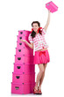 Young woman with storage boxes on white