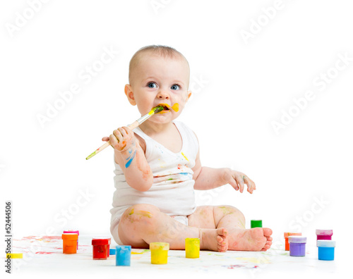 Photo: dirty child drawing with a finger's paints dirty child drawing with a finger's paints