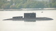 Moored submarine in harbor