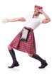 Scottish man dancing on white