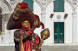 canvas print picture - Venetian costume attends Carnival of Venice.