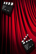 Movie clapper board against curtain