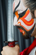 Man with sword and face mask