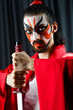 Man with sword and face mask