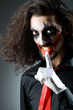 Joker personification with man in dark room