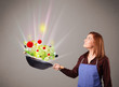 Photo: Young woman cooking fresh vegetables Young woman cooking fresh vegetables