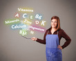 Photo: Young woman cooking vitamins and minerals Young woman cooking vitamins and minerals