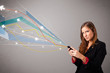 Photo: pretty young lady holding a phone with colorful abstract lines a pretty young lady holding a phone with colorful abstract lines a