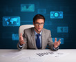 Photo: Businessman doing paperwork with digital background Businessman doing paperwork with digital background