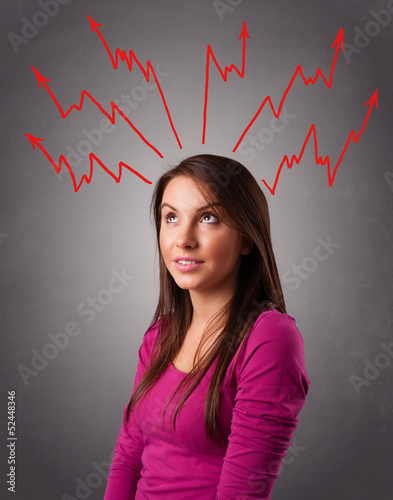 Photo: Young woman thinking with arrows overhead Young woman thinking with arrows overhead