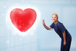 Young nurse healing a red heart