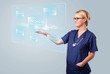 Young nurse pressing modern medical type of buttons