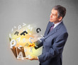 Middle aged businessman holding laptop with colorful letters