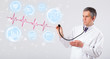 Doctor examinating modern heartbeat graphics