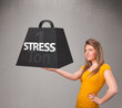 Young woman holding one ton of stress weight