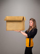 Young woman holding an empty cardboard box