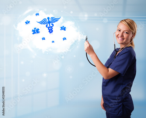 Photo: Young doctor with abstract cloud and medical icons Young doctor with abstract cloud and medical icons