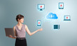 young woman holding a laptop and presenting cloud computing netw