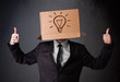 Businessman gesturing with a cardboard box on his head with ligh