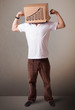 Young man gesturing with a cardboard box on his head with diagra