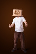 Young man gesturing with a cardboard box on his head with spur w