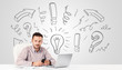 Foto: Young businessman brainstorming with drawn arrows and symbols Young businessman brainstorming with drawn arrows and symbols