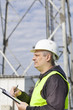 Foto: Foreperson with folder near GSM tower Foreperson with folder near GSM tower
