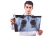 Young doctor with x-ray image on white