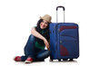 Photo: Young woman with suitcase isolated on white Young woman with suitcase isolated on white
