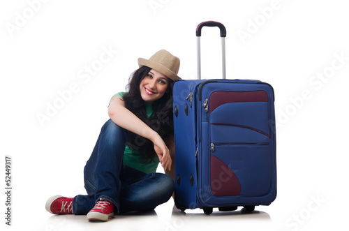Photo: Young woman with suitcase isolated on white Young woman with suitcase isolated on white