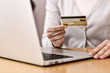 Close-up woman's hands holding a credit card
