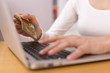 Close-up woman's hands holding a credit card
