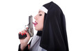 Nun with gun isolated on the white