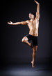 Dancer dancing in the dark studio