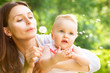 Beautiful Mother And Baby outdoors. Nature