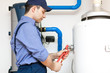Photo: Young plumber at work Young plumber at work