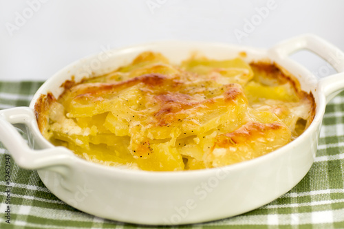 Photo: baked potatoes in a porcelain pan baked potatoes in a porcelain pan