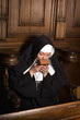 Nun kissing prayer book