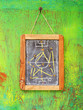 soccer tactics on chalkboard, hanging on green background