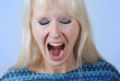 Foto: Young blonde woman with a cry Young blonde woman with a cry