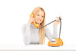 Young smiling female talking on a retro phone