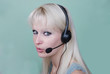Foto: Portrait of young woman with headset Portrait of young woman with headset