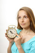 Photo: woman with alarm clock, isolated on white woman with alarm clock, isolated on white