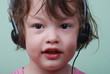 Foto: Girl listening to with headphones Girl listening to with headphones