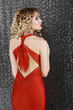 Elegance. Fashion Woman in Red Prom  Dress. Rear View