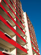 Modern tall residential building on a background of blue sky