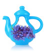 Beautiful bouquet of cornflowers in vase-teapot, isolated