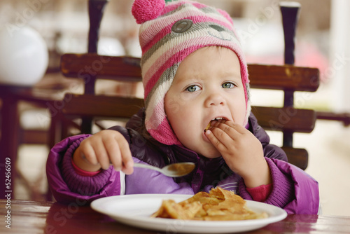 Photo: eating toddler girl eating toddler girl