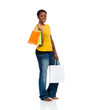 Photo: An African American young woman with shopping bags on a white ba An African American young woman with shopping bags on a white ba