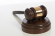 Photo: Wooden judge's gavel on white Wooden judge's gavel on white